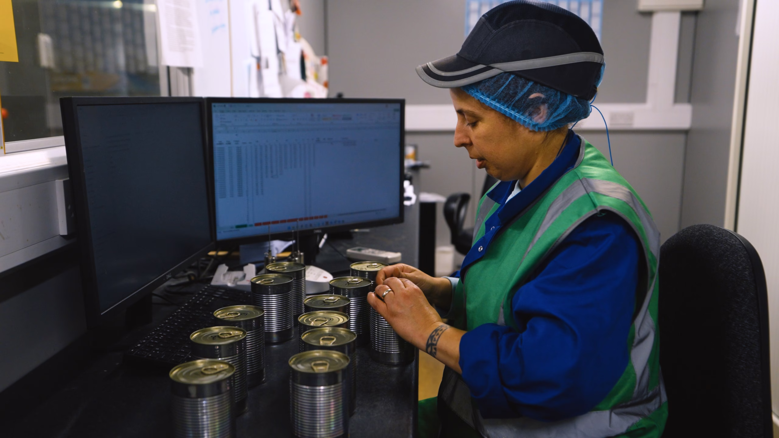Quality technician monitoring pet food quality control process